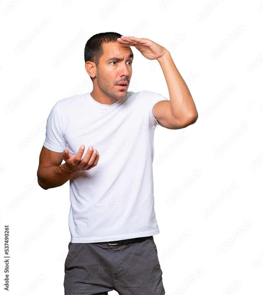 Concentrated young man with a gesture of looking away Concentrated young man with a gesture of looking away