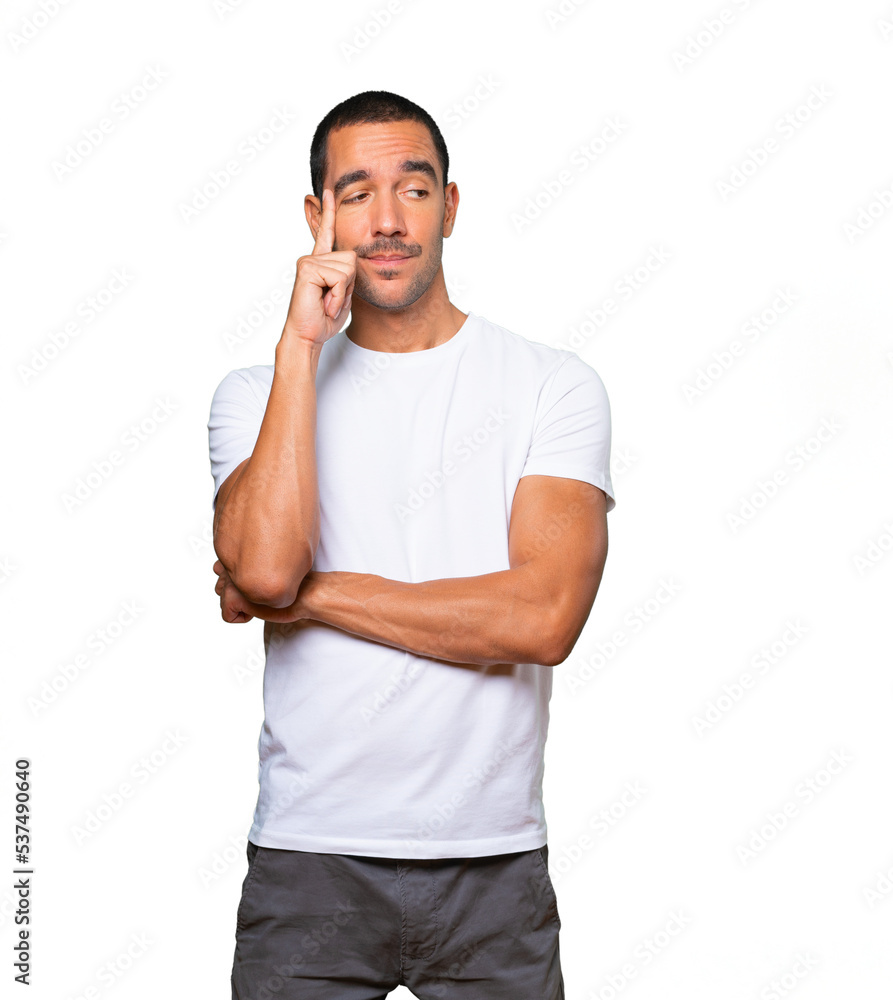 Hesitant young man looking up gesture Hesitant young man looking up gesture
