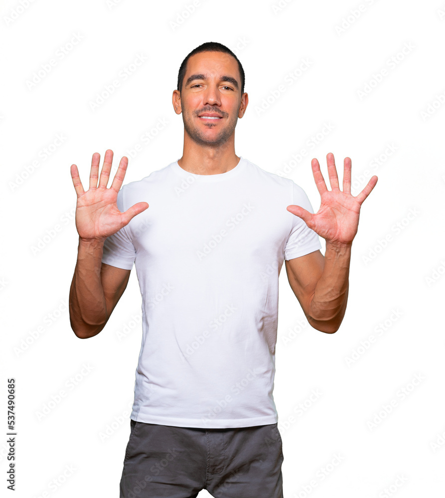 Young man making a number ten gesture Young man making a number ten gesture