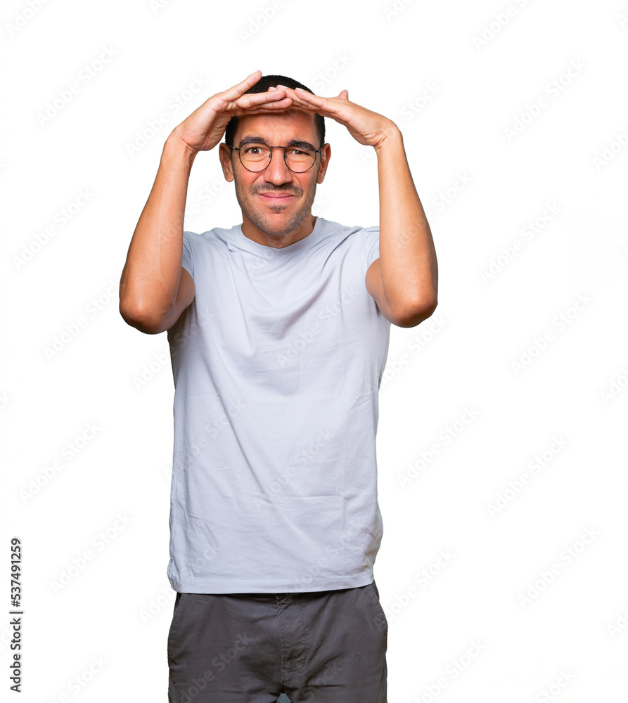 Concentrated young man with a gesture of looking away Concentrated young man with a gesture of looking away