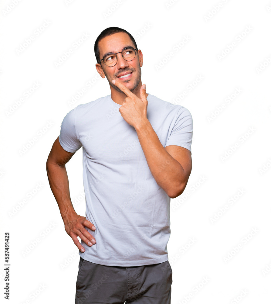 Fototapeta premium Happy young man making a gesture of doubt