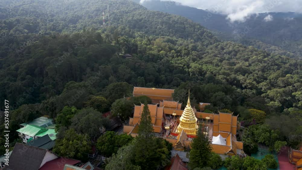 Drone view over traditional Thai Temple hidden in Jungle Drone view over traditional Thai Temple hidden in Jungle