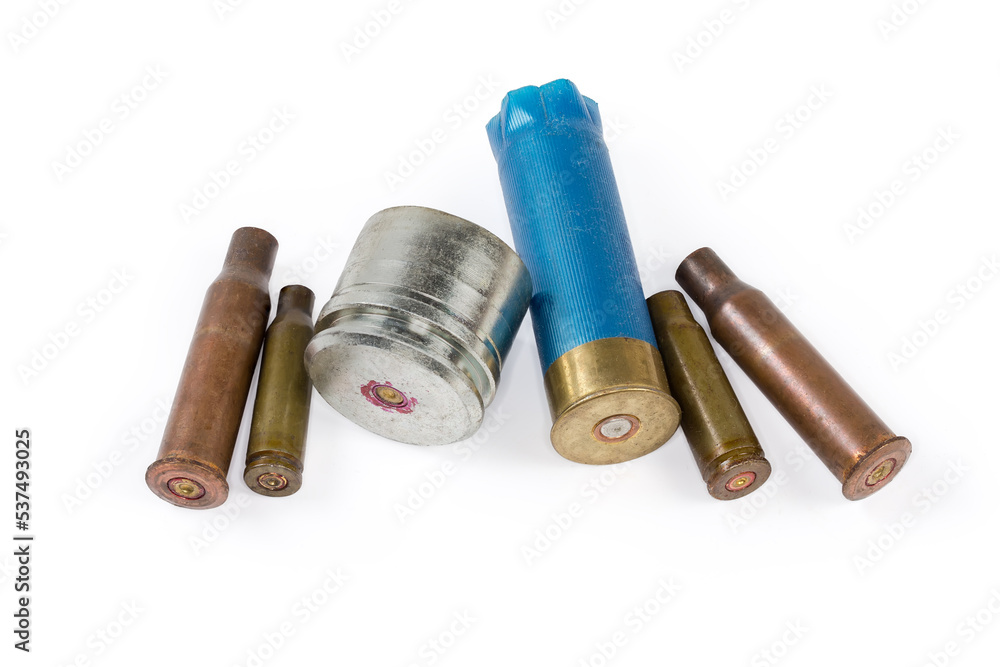 Spent shells different calibers from firearms on a white background Spent shells different calibers from firearms on a white background