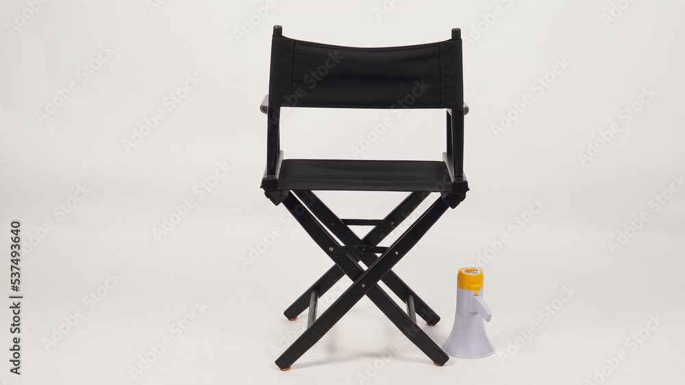 Back of Black director chair and megaphone on white background. Stock