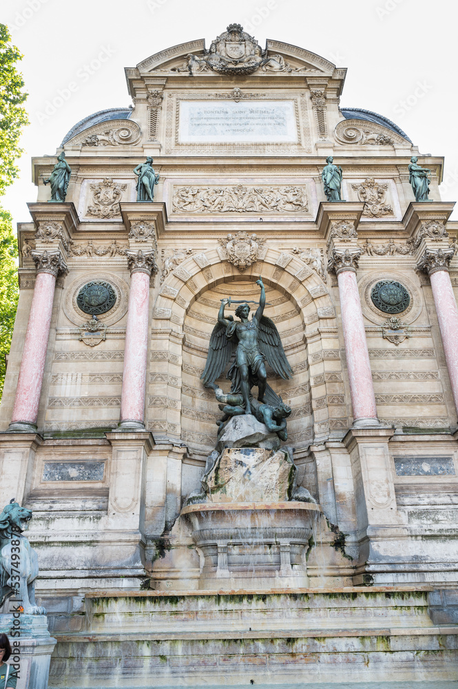 The Fontaine Saint-Michel located in Place Saint-Michel in the 6th arrondissement in Paris, France. Archangel Michael and the devil, by Francisque-Joseph Duret