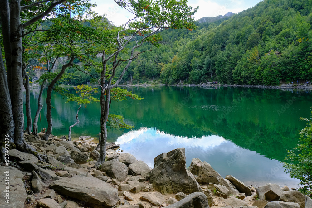 Lake Santo, Lago Santo across the mountains and woods. Nature reflects on the surface of the lake. National park Appennino Tosco-Emiliano. Lagdei, Emilia-Romagna
