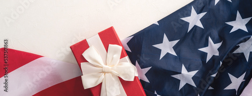 Fototapeta Naklejka Na Ścianę i Meble -  United States election design concept, American Flag over white table background with gift.