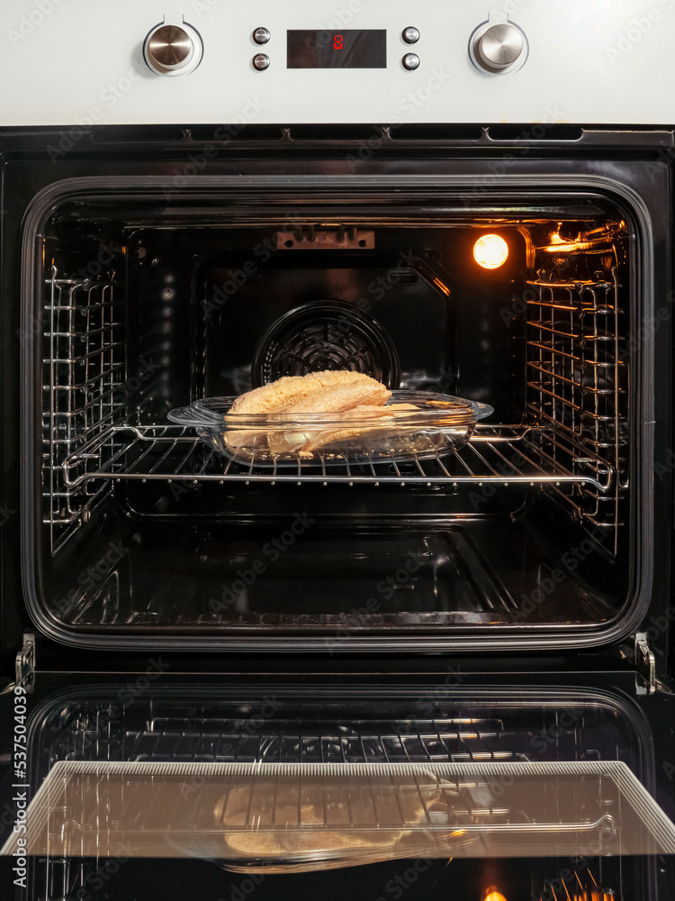 open electric oven with hot air ventilation. New oven. Door is