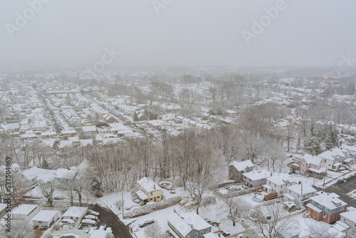 There is small town on the coast of New Jersey named Sayreville, that consists home complex that is covered in white snow during the winter months. photo