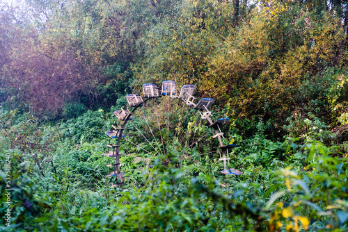 Abandoned watermill in the middle of the forest photo