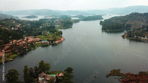 Resorts And Hotel Surrounded The Coastal Town Of Lake Bunyonyi In South-Western Uganda. Aerial Drone Shot photo