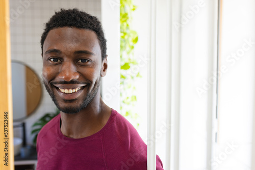 Portrait of happy african american man looking at camera and smiling