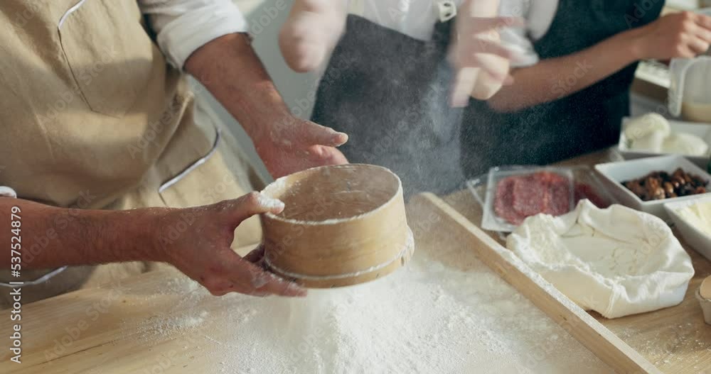 Funny momets kid's hands clapping in hands with flour while father sieving flour on wooden board.Cooking baking process concept. Pizza time in modern kitchen. Funny momets kid's hands clapping in hands with flour while father sieving flour on wooden board.Cooking baking process concept. Pizza time in modern kitchen.