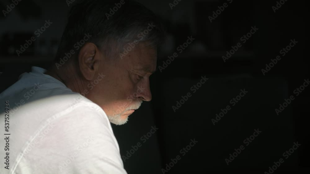 Senior caucasian man with mental problem sitting in darkness. Shot with RED helium camera in 8K. Senior caucasian man with mental problem sitting in darkness. Shot with RED helium camera in 8K.