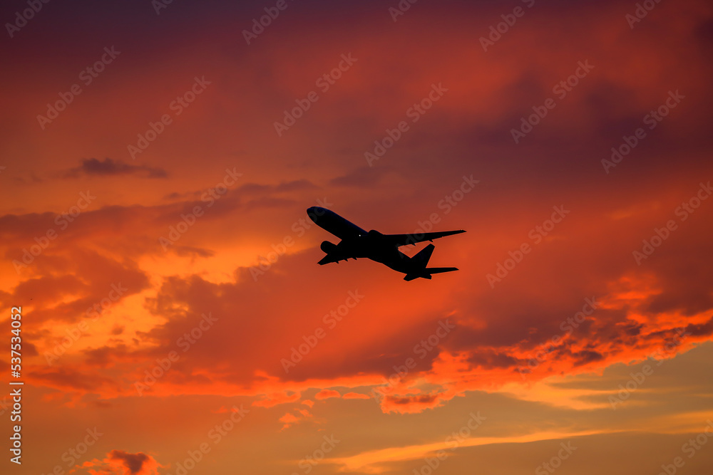 silhouette airplane in the sunset