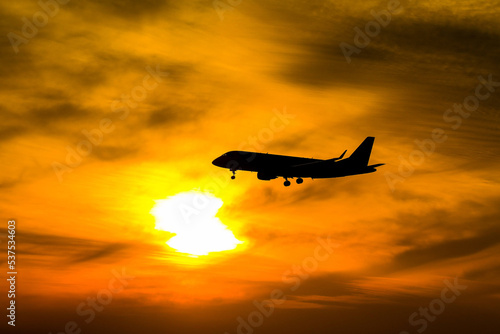 silhouette airplane in the sunset