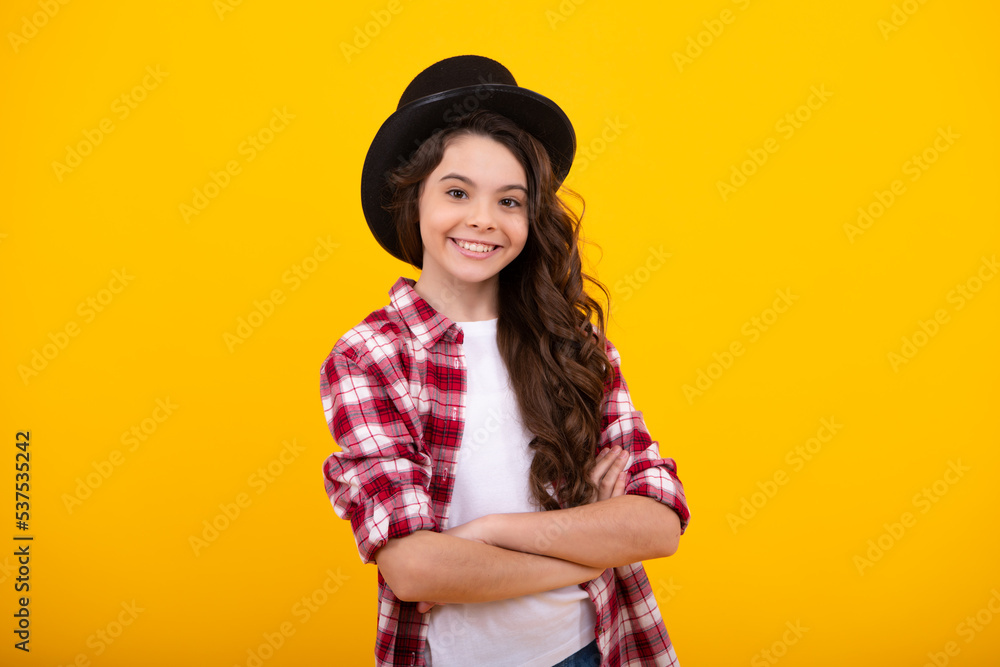 Kids girl in old fashion clothes. Elegent hat, cylinder hat isolated on yellow background. Headwear. Clothes accessories. Fashion headwear for gentlemen in vintage style, old classic cylinder. Kids girl in old fashion clothes. Elegent hat, cylinder hat isolated on yellow background. Headwear. Clothes accessories. Fashion headwear for gentlemen in vintage style, old classic cylinder.