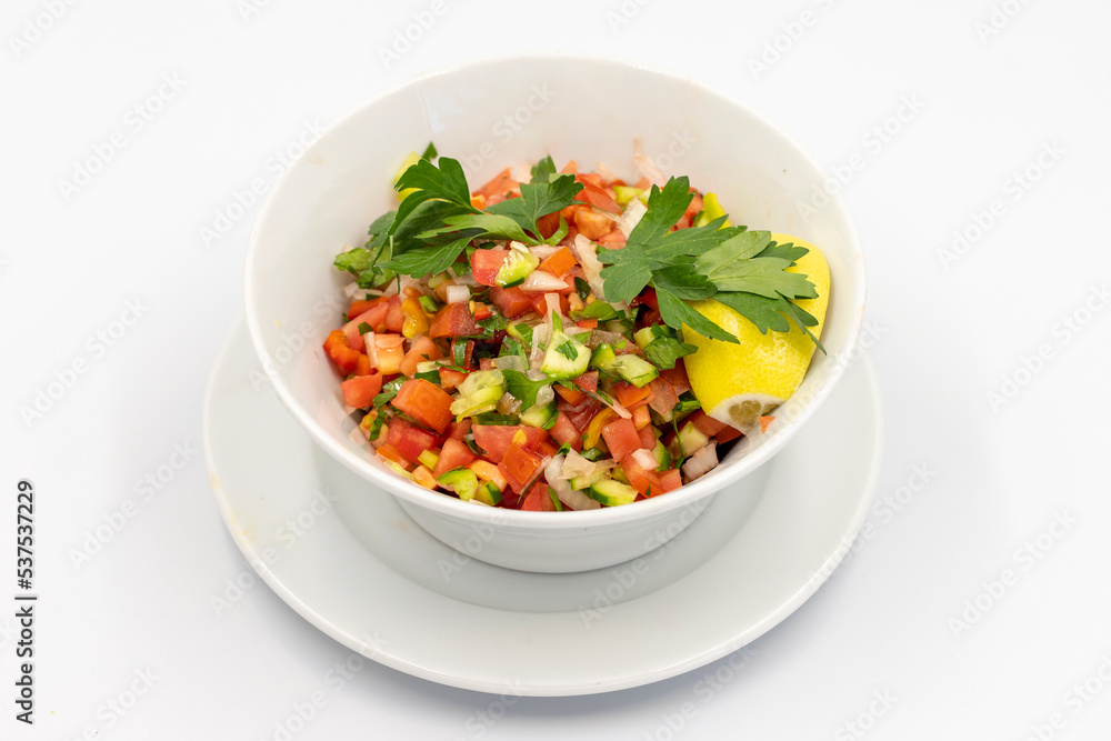 Salad on isolated on white background. Salad with tomato, cucumber and pepper. close up Salad on isolated on white background. Salad with tomato, cucumber and pepper. close up