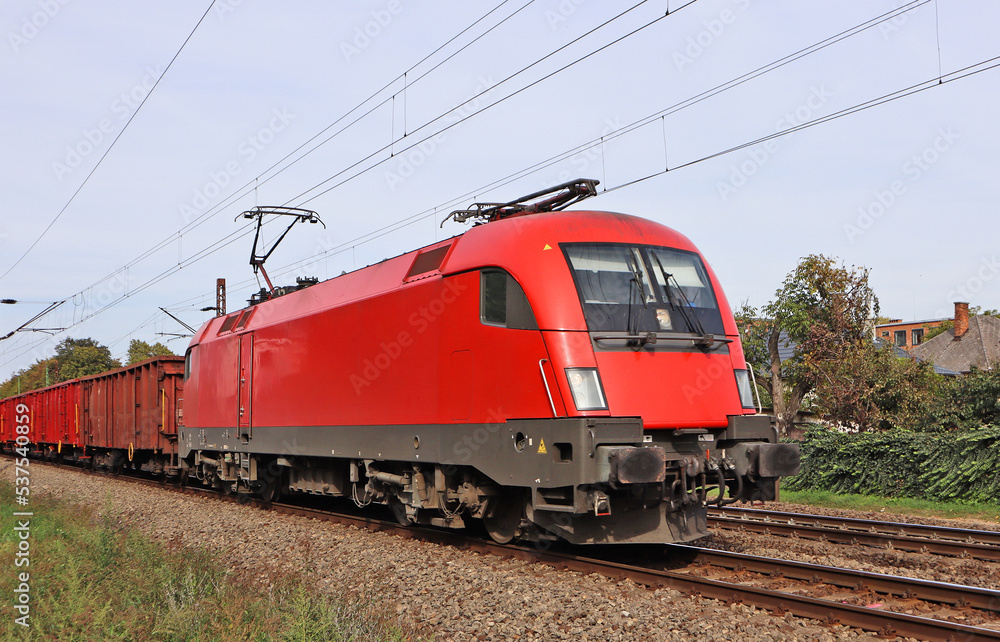 Red engine on the railway track