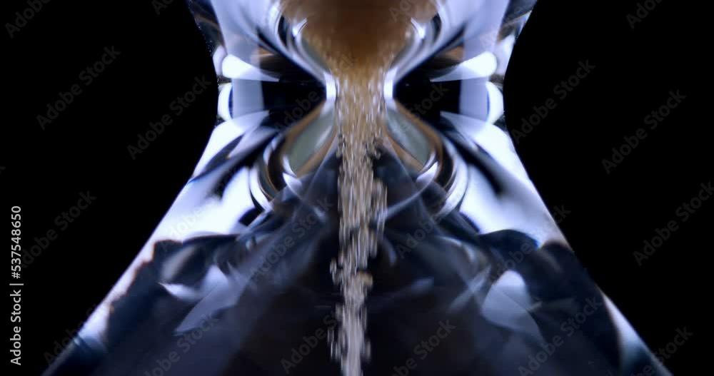 Video Stock Hourglass. Sands move through hour glass. Sandglass close