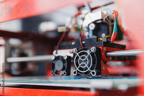Modern 3D printer printing figure home close-up macro