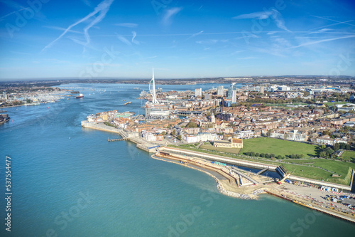 Aerial photo of the entrance to Portsmouth Harbour in Southern England with the Spinnaker Tower in view.