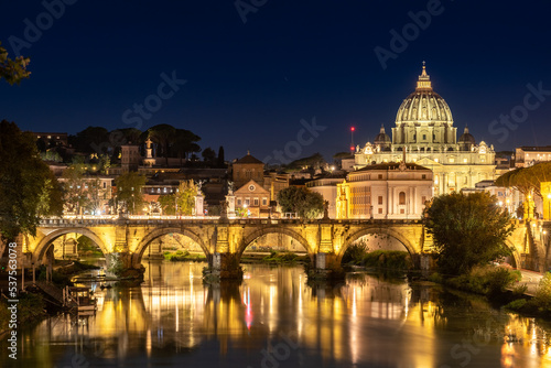 Panoramic View of the Dome of the Basilic of Saint Peter in Rome beside the Bridge on the Tevere River in Rome at Sunset © daniele russo