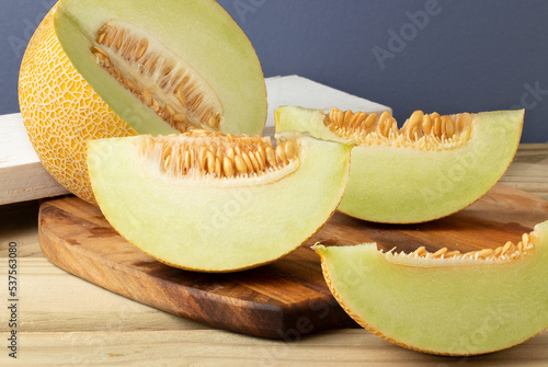 Ripe melon on cutting board.