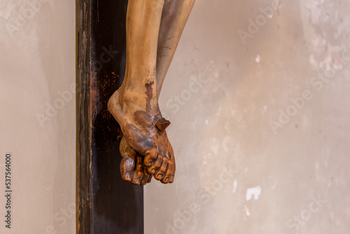 Close Up of the Feet of Wooden Crucifix In The Basilic of Saint Clemens in Rome, Soiled by the Hands of the Faithful Who Touched It Over the Years