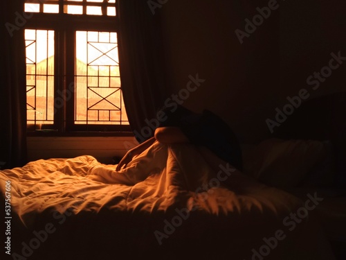 a man in the room at the dusk
