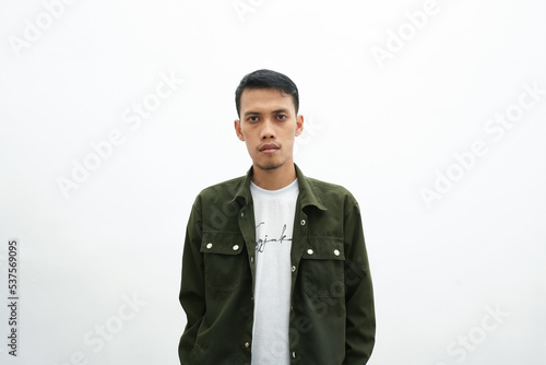 Asian man wearing a casual green shirt stylish cool like a model. isolated white background