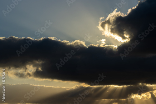 Sunlight streaming through clouds © Seif