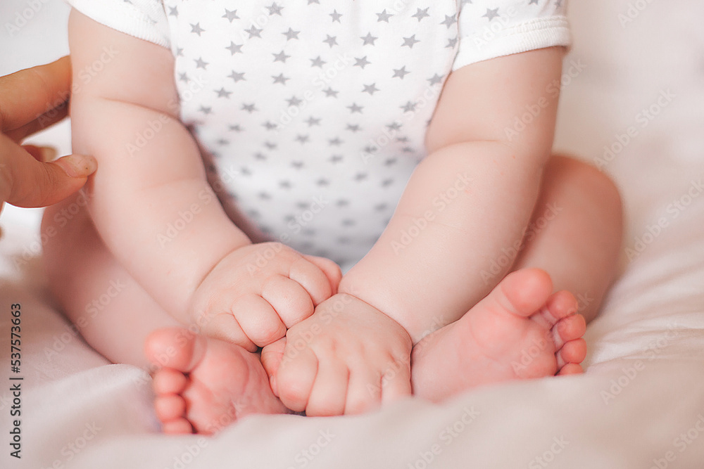 Tiny little baby feet. Adorable baby fingers. Cute infant closeup Tiny little baby feet. Adorable baby fingers. Cute infant closeup
