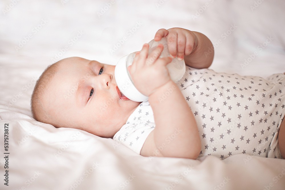 Little cute baby eating formula. Infant feedeng Little cute baby eating formula. Infant feedeng