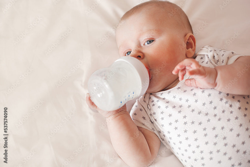 Little cute baby eating formula. Infant feedeng Little cute baby eating formula. Infant feedeng