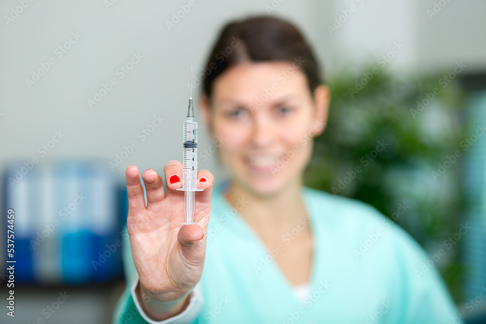 beautiful nurse is holding injection beautiful nurse is holding injection