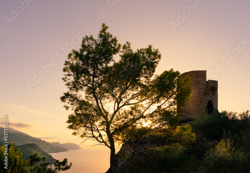 Torre des Verger o Torre de ses Ànimes a la puesta de sol. Torre de defensa del siglo XVI,  junto a Banyalbufar, que es un mirador al mar y a las montañas de la Serra de Tramuntana, en Mallorca. photo