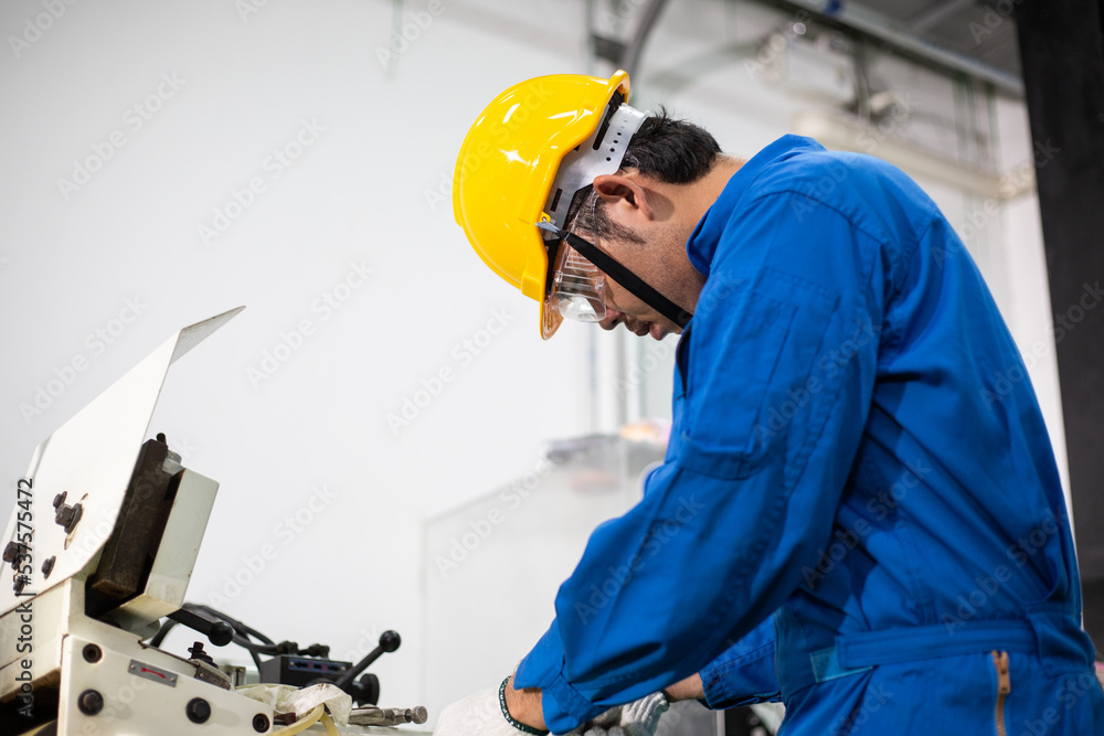 experienced operator technician worker or engineer metalworker industrial in safety helmet working or repair on metal machine, professional maintenance skill man in industry manufacturing. men at work experienced operator technician worker or engineer metalworker industrial in safety helmet working or repair on metal machine, professional maintenance skill man in industry manufacturing. men at work