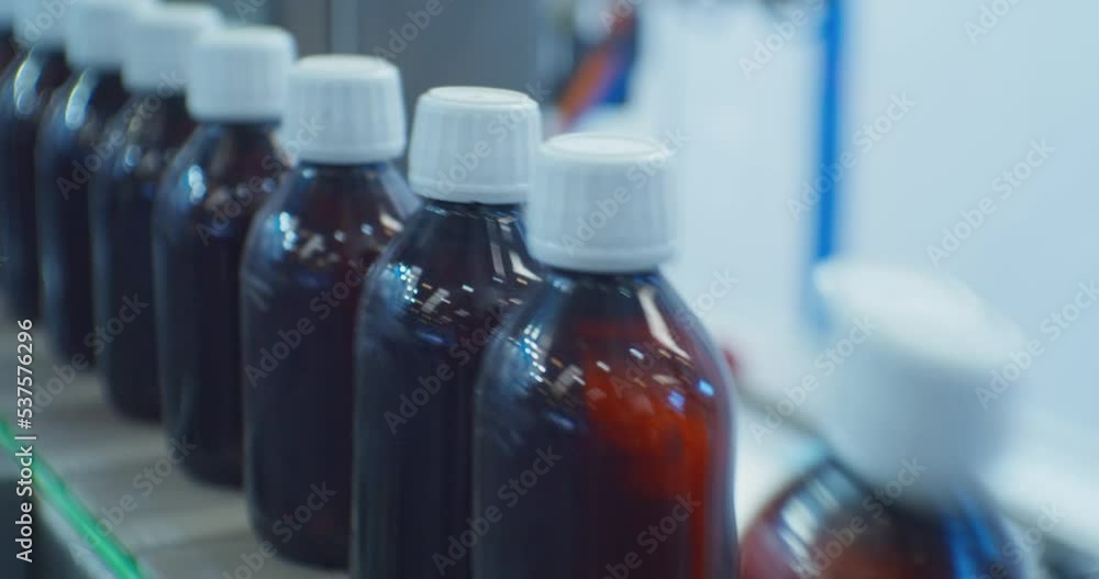 closed plastic bottles move along the conveyor.close-up. closed plastic bottles move along the conveyor.close-up.