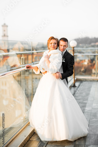 Romantic wedding moment, couple of newlyweds smiling portrait, bride and groom hugging