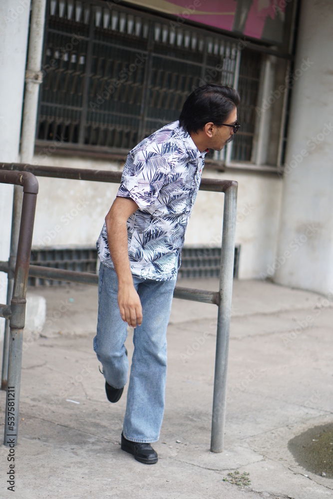 man posing with pole