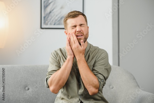 Wall Mural Man suffering from strong toothache