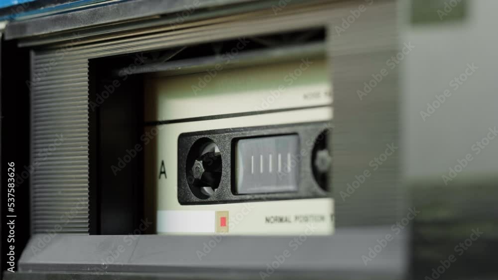 Retro radio tape recorder, audio cassette playing close-up. Listening to music, recording studio old radio boombox player, searching channel, volume. Retro radio tape recorder, audio cassette playing close-up. Listening to music, recording studio old radio boombox player, searching channel, volume.
