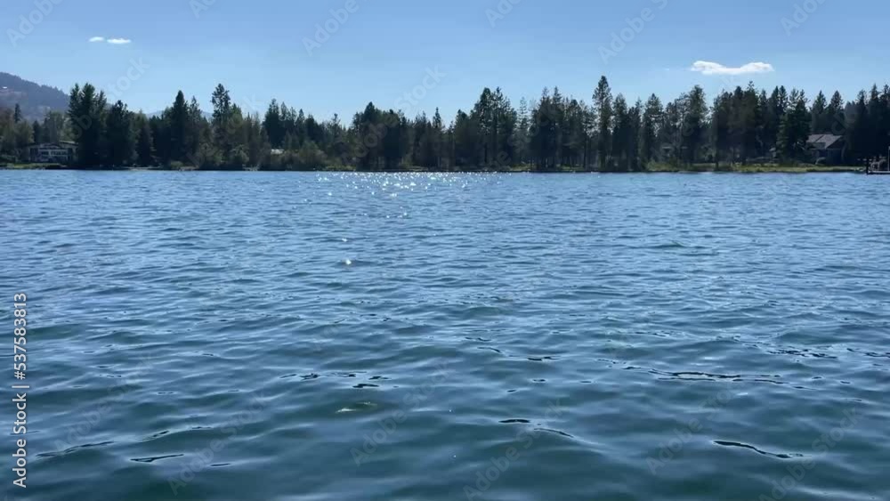Water Sparkles while looking back at shore on Lake Pend Oreille in Idaho Water Sparkles while looking back at shore on Lake Pend Oreille in Idaho