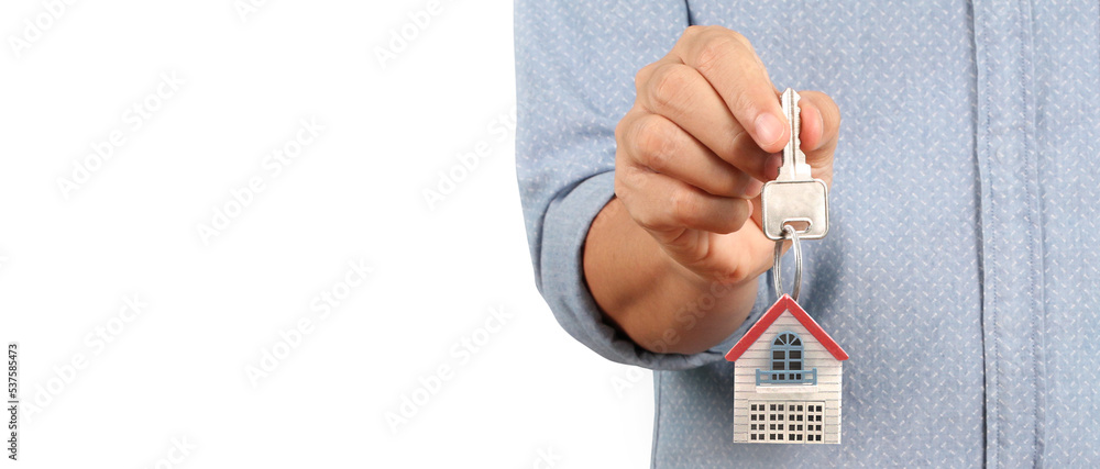 Fototapeta premium Real estate agent handing over house keys in hand
