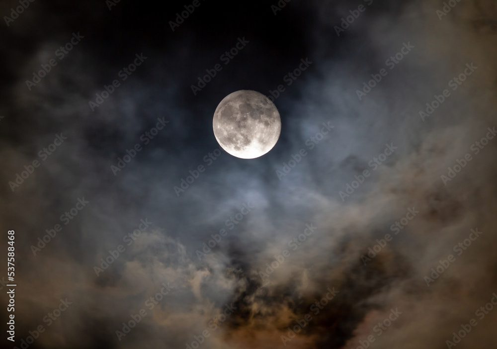 Full Moon at Night with Passing Colorful Clouds Full Moon at Night with Passing Colorful Clouds