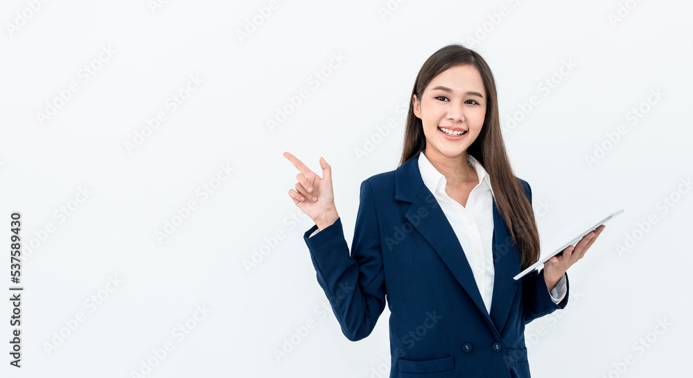 Portrait images of an Asian businesswoman, is standing holding a tablet, smile and using her finger to point to and empty area, on white background. to business advertising concept. Portrait images of an Asian businesswoman, is standing holding a tablet, smile and using her finger to point to and empty area, on white background. to business advertising concept.