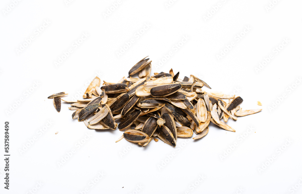 Helha from sunflower seeds on a white background. Purified cake from oil production. Helha from sunflower seeds on a white background. Purified cake from oil production.