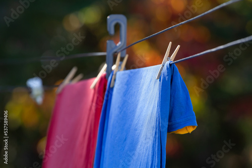 Red and blue t-shirts on clothes or laundry line