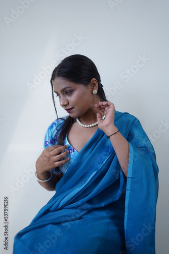 dusky girl wearing blue saari photo